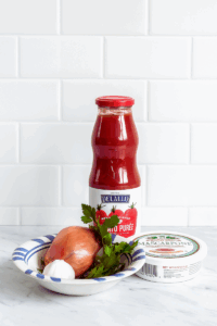 Creamy stovetop pasta with sausage and cheese in a rich tomato sauce